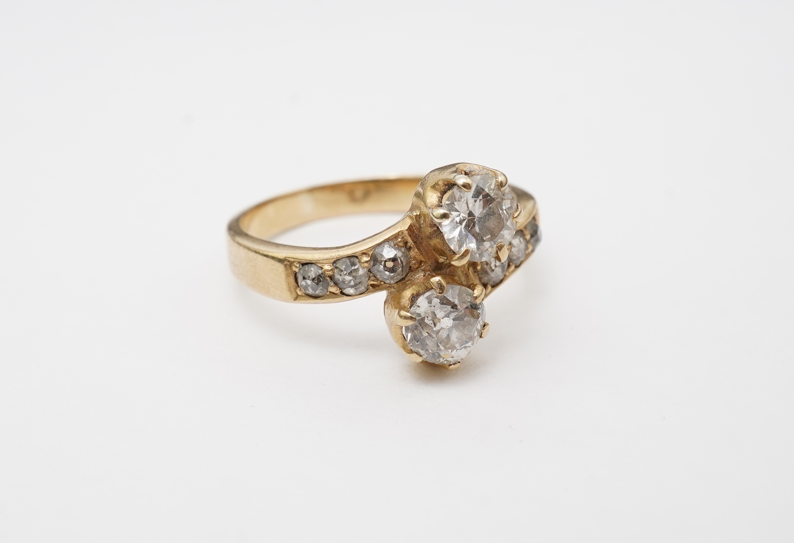 A gold and diamond 'toi-et-moi' ring, circa 1900